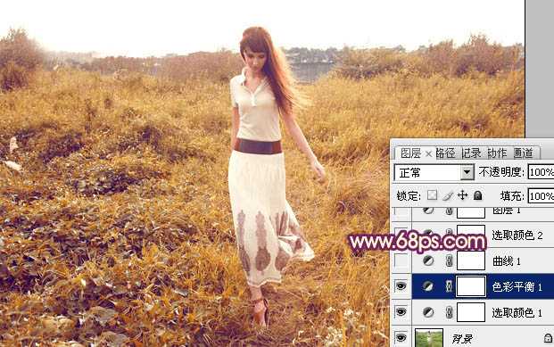 ‘Photoshop将草地人物图片调制出秋季漂亮的橙色效果‘