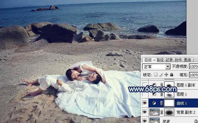 ‘Photoshop将沙滩婚片打造出经典暗蓝色效果‘
