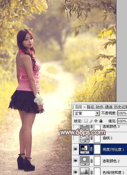 ‘Photoshop为树林人物图片调出柔美的秋季橙黄色‘