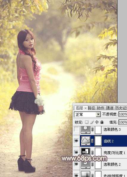 ‘Photoshop为树林人物图片调出柔美的秋季橙黄色‘
