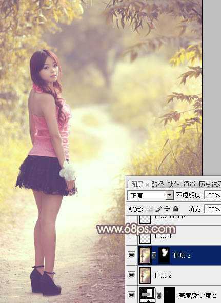 ‘Photoshop为树林人物图片调出柔美的秋季橙黄色‘