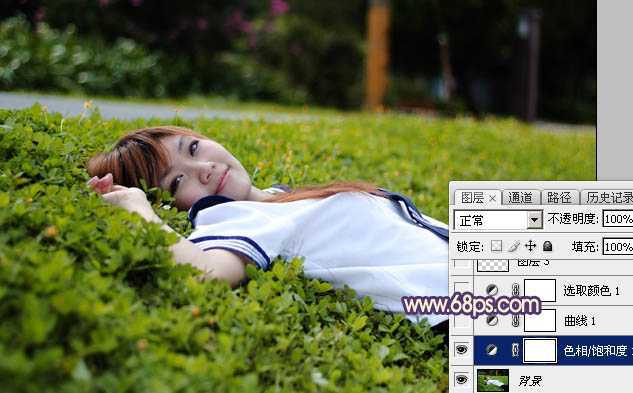‘Photoshop为躺在草地人物图片打造唯美梦幻的暗褐色‘