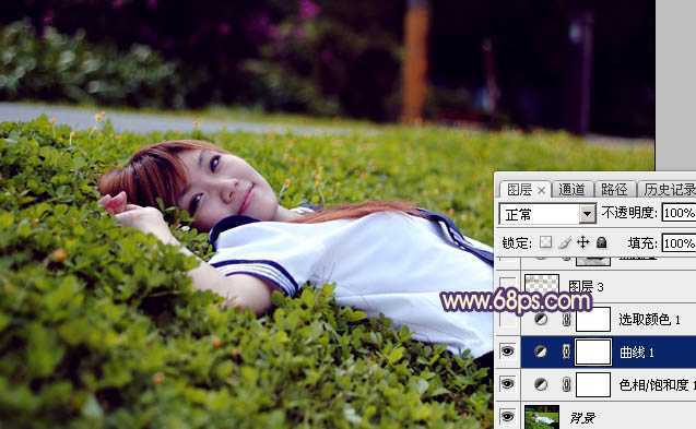 ‘Photoshop为躺在草地人物图片打造唯美梦幻的暗褐色‘
