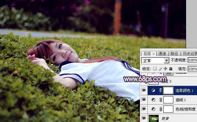 ‘Photoshop为躺在草地人物图片打造唯美梦幻的暗褐色‘