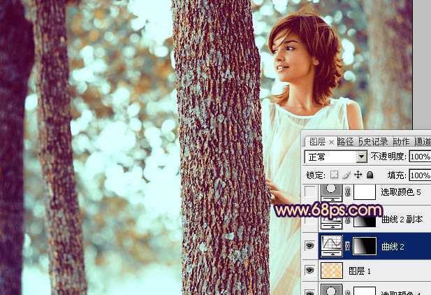 ‘Photoshop为树林人物图片调制出灿烂的青黄阳光色效果‘