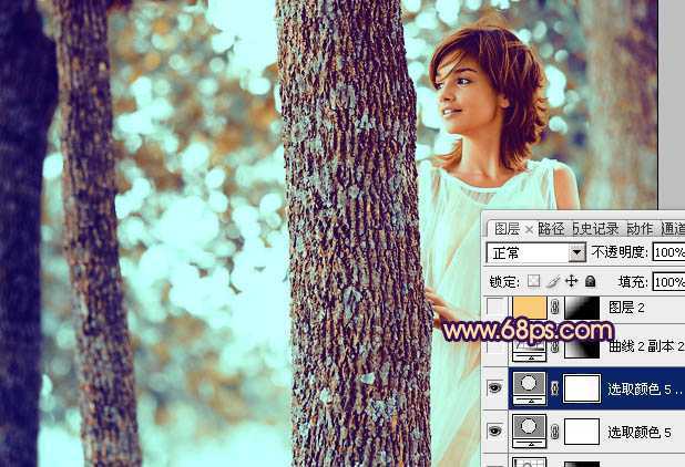 ‘Photoshop为树林人物图片调制出灿烂的青黄阳光色效果‘