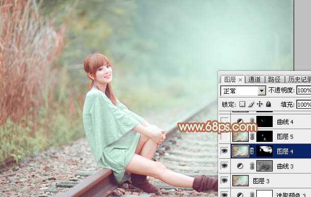 ‘Photoshop打造甜美的淡调青绿色铁轨美女图片‘