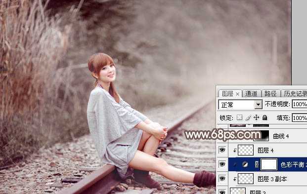 ‘Photoshop调出唯美的冬季红褐色铁轨美女图片‘