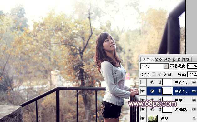 ‘Photoshop将景区人物图片调制出淡淡的蓝黄秋季色‘