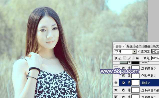 ‘Photoshop将绿树边的美女调制出淡美的蓝黄色‘