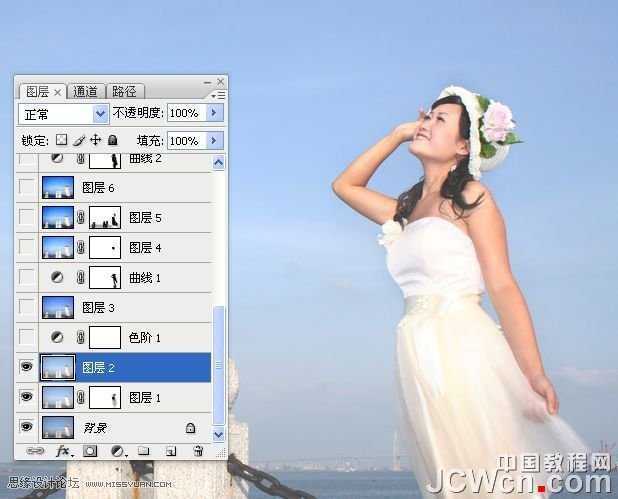 ‘Photoshop调出海景人物图片纯美的蓝色调‘