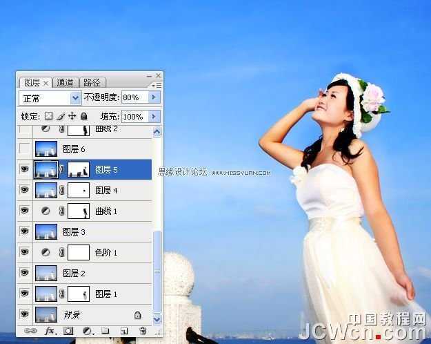 ‘Photoshop调出海景人物图片纯美的蓝色调‘