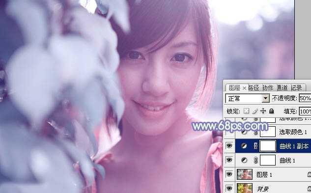 ‘photoshop利用通道替换将树叶边的美女图片调出梦幻的淡蓝色‘