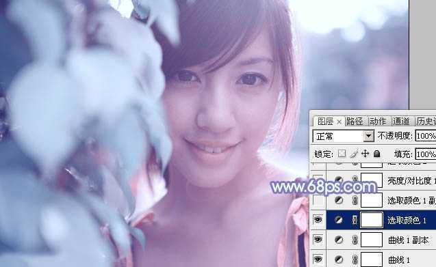 ‘photoshop利用通道替换将树叶边的美女图片调出梦幻的淡蓝色‘