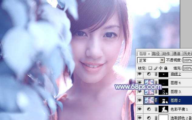 ‘photoshop利用通道替换将树叶边的美女图片调出梦幻的淡蓝色‘