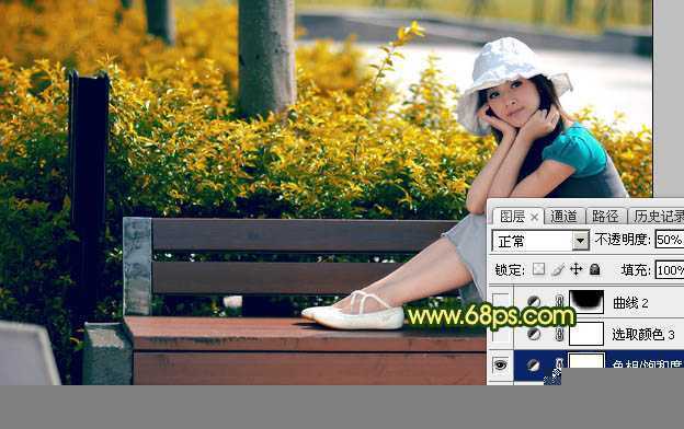 ‘Photoshop调制出暗调秋季黄褐色花坛边美女图片‘