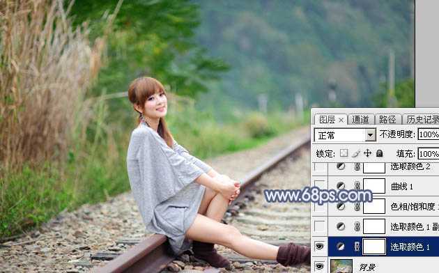 ‘Photoshop为铁轨上的美女加上梦幻甜美的蓝色效果‘