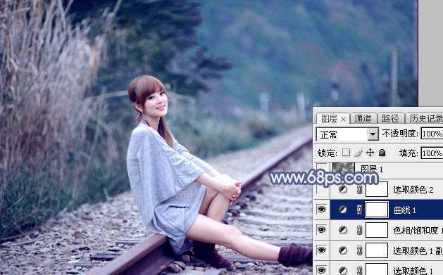‘Photoshop为铁轨上的美女加上梦幻甜美的蓝色效果‘