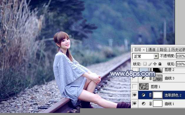 ‘Photoshop为铁轨上的美女加上梦幻甜美的蓝色效果‘