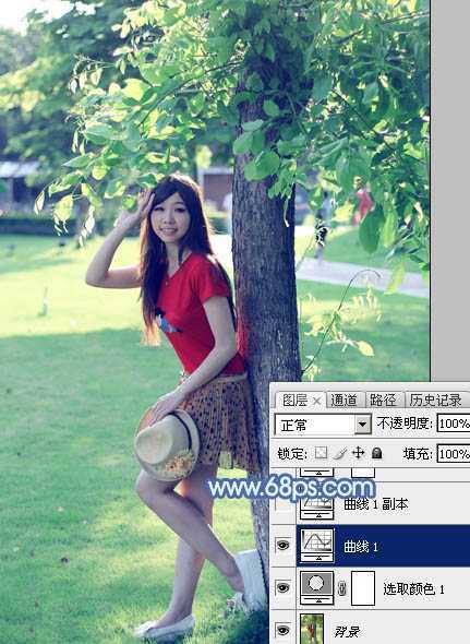 ‘Photoshop为树边的女孩增加流行的淡调青蓝色‘