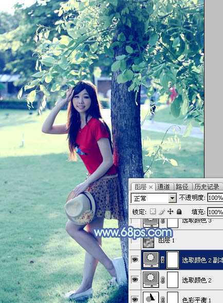 ‘Photoshop为树边的女孩增加流行的淡调青蓝色‘