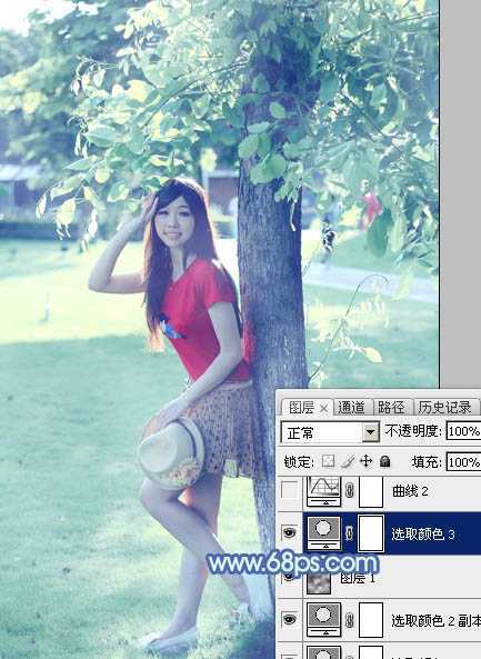‘Photoshop为树边的女孩增加流行的淡调青蓝色‘