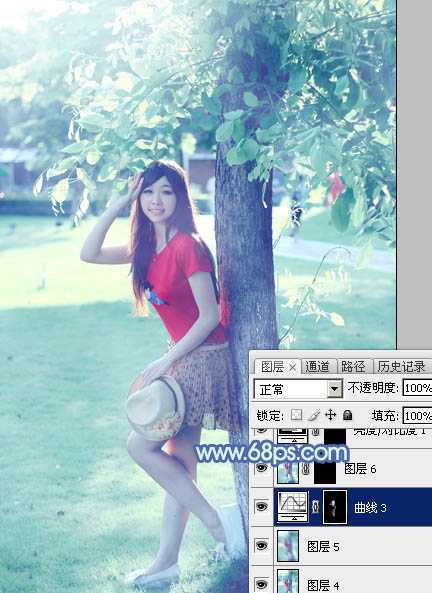 ‘Photoshop为树边的女孩增加流行的淡调青蓝色‘