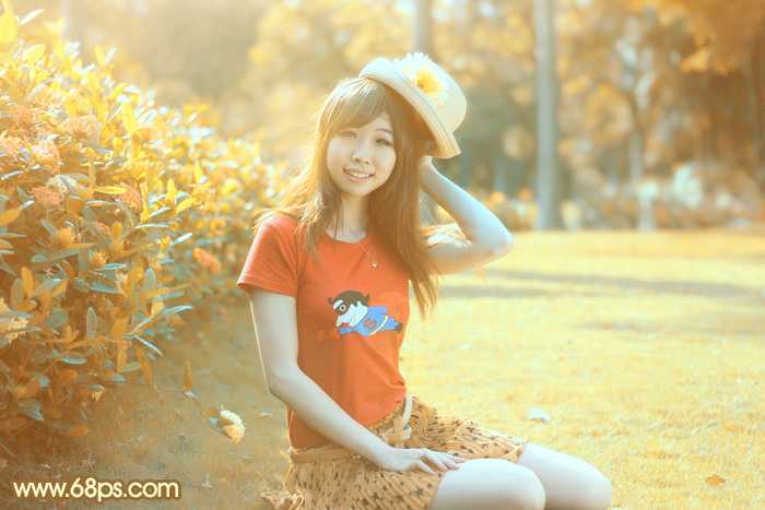 ‘Photoshop将花园中的人物图片调制出唯美的金色调‘