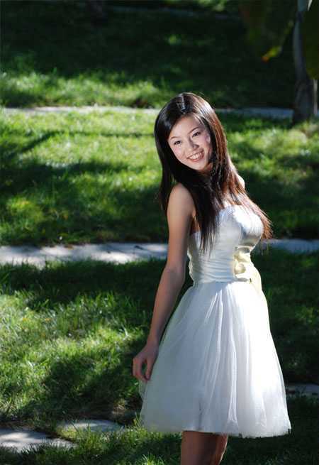 ‘Photosho将晨曦中灿烂的美女图片打造出橙蓝色效果‘