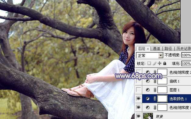 ‘Photoshop为大树上的美女加上秋季晨曦蓝黄色效果‘