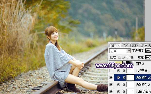 ‘Photoshop调制出淡黄色的秋季铁轨小清新美女图片‘