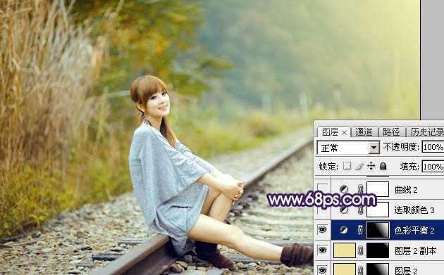 ‘Photoshop调制出淡黄色的秋季铁轨小清新美女图片‘