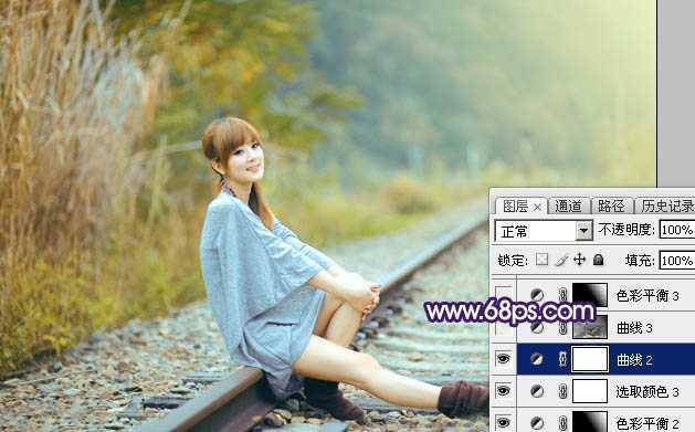 ‘Photoshop调制出淡黄色的秋季铁轨小清新美女图片‘