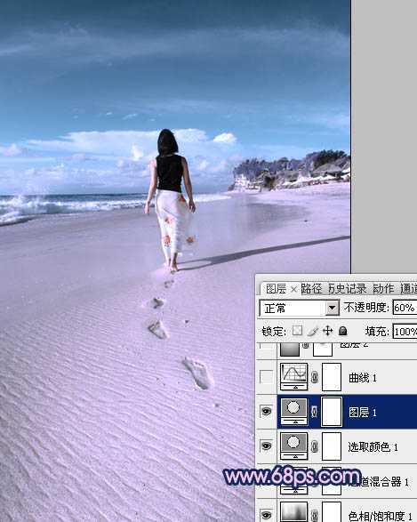 ‘Photoshop将沙滩人物图片调成漂亮的淡蓝色‘