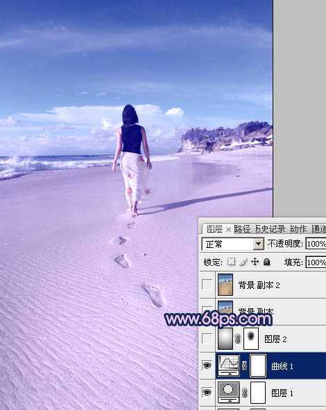 ‘Photoshop将沙滩人物图片调成漂亮的淡蓝色‘