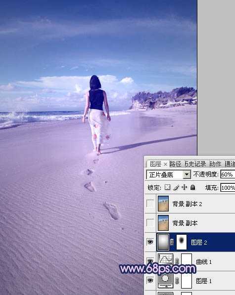‘Photoshop将沙滩人物图片调成漂亮的淡蓝色‘