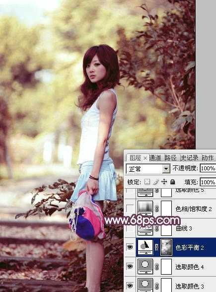 ‘Photoshop将美女树景图片打造柔美的暗调红褐色‘