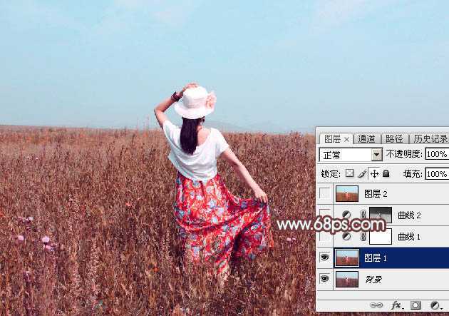 ‘Photoshop为荒草中的美女加上唯美的秋季红褐色‘