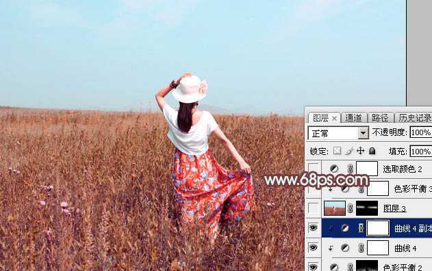 ‘Photoshop为荒草中的美女加上唯美的秋季红褐色‘