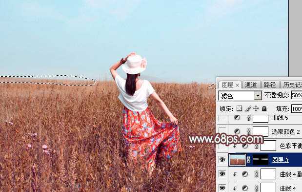 ‘Photoshop为荒草中的美女加上唯美的秋季红褐色‘