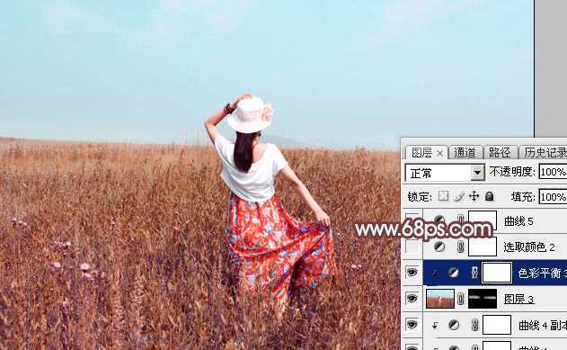 ‘Photoshop为荒草中的美女加上唯美的秋季红褐色‘