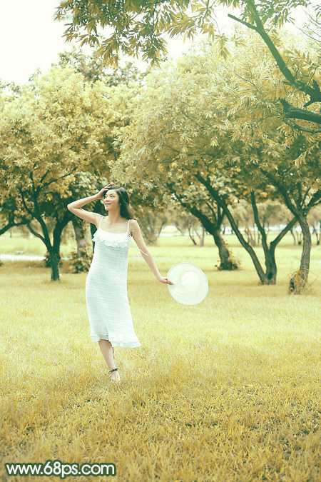 ‘Photoshop将树景人物图片打造灿烂的黄绿色‘