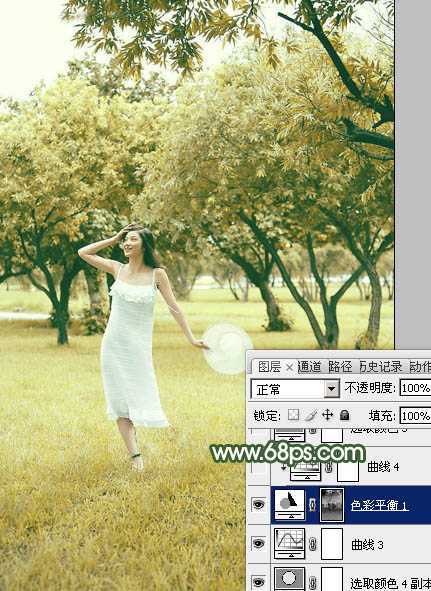 ‘Photoshop将树景人物图片打造灿烂的黄绿色‘