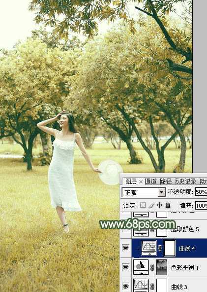 ‘Photoshop将树景人物图片打造灿烂的黄绿色‘