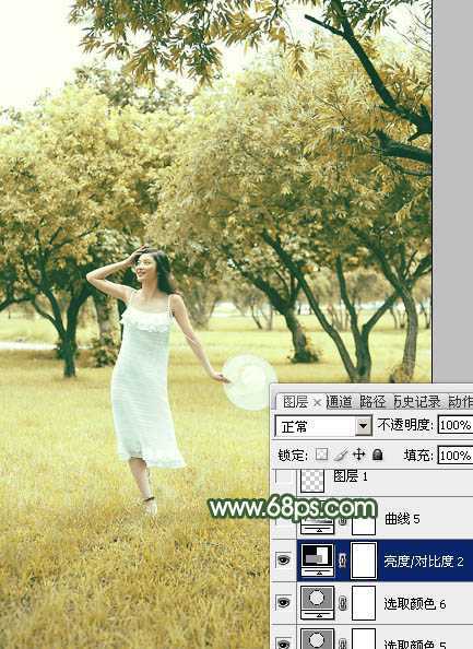 ‘Photoshop将树景人物图片打造灿烂的黄绿色‘
