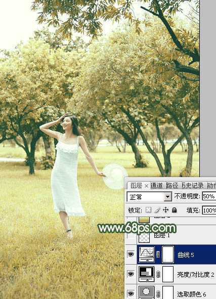 ‘Photoshop将树景人物图片打造灿烂的黄绿色‘