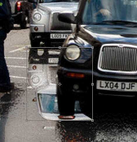 ‘Photoshop将街道图片调出雨水湿润的路面‘