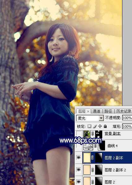 ‘Photoshop将大树边的人物调制出斑斓的霞光暖色‘