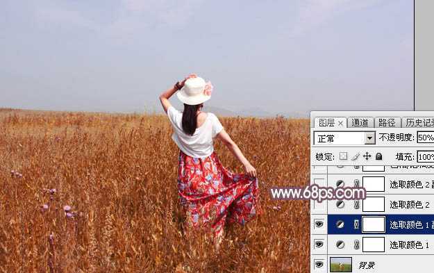 ‘Photoshop为荒草中的人物调出逆光暗调青红色‘