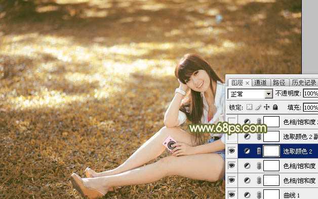 ‘Photoshop为草地上的美女加上甜美的深秋黄褐色‘
